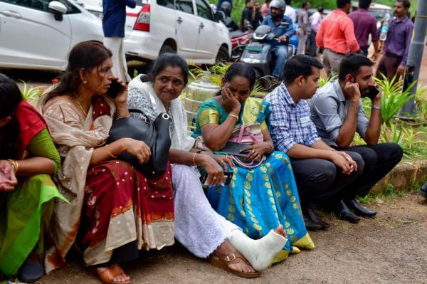 Jehovah's Witness faithful and others wait outside the Zamra Internatio<em></em>nal Co<em></em>nvention Center after an explosive device blew up during their prayer session in Kalamassery, a town in Kochi, southern Kerala state, India, Sunday, Oct.29, 2023.
