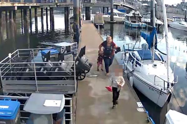 A shot of the stunned mother and child leaving the dock.