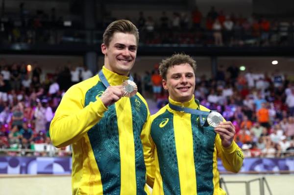 PARIS, FRANCE - AUGUST 11: (L-R) Bro<em></em>nze medalist Matthew Glaetzer and Silver medalist Matthew Richardson pose at podium after the Men's Keirin, Final on day sixteen of the Olympic Games Paris 2024 at Saint-Quentin-en-Yvelines Velodrome on August 11, 2024 in Paris, France. (Photo by Jared C. Tilton/Getty Images)