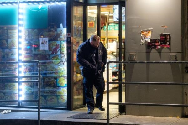 Police investigate a shooting on 41st Avenue and 21st Street in Astoria, Queens, New York City on Monday, November 20, 2023. (Gardiner Anderson for New York Daily News)