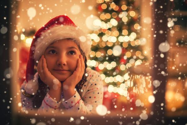 A little girl waiting for Santa on Christmas Eve.